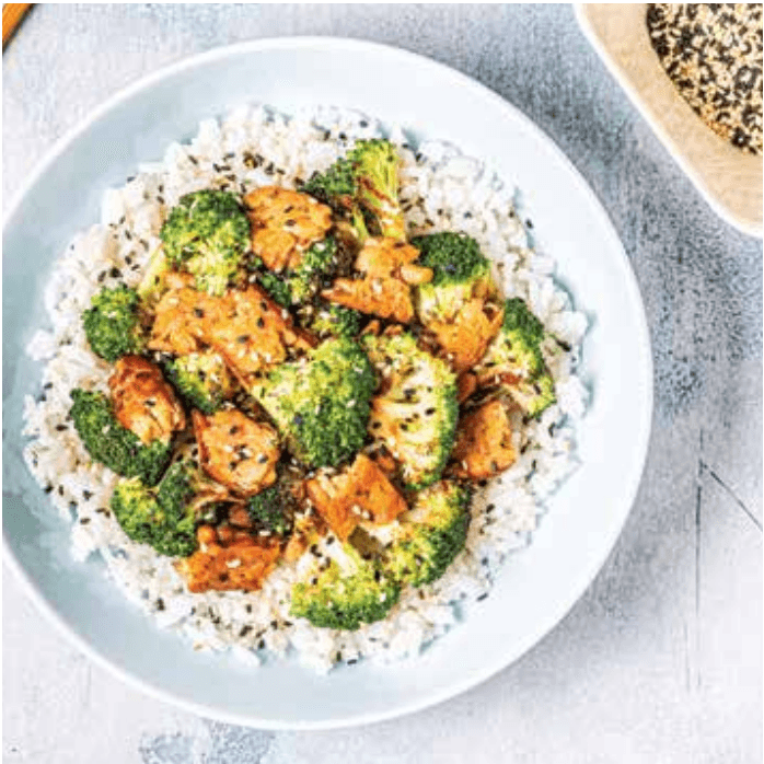 Rice bowl with broccoli and sesame-topped protein